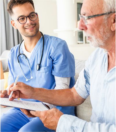 Home health care physician meeting with man in his home and performing a health assessment